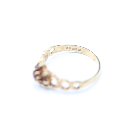 158 - 9ct gold garnet posy ring (2g) Size O