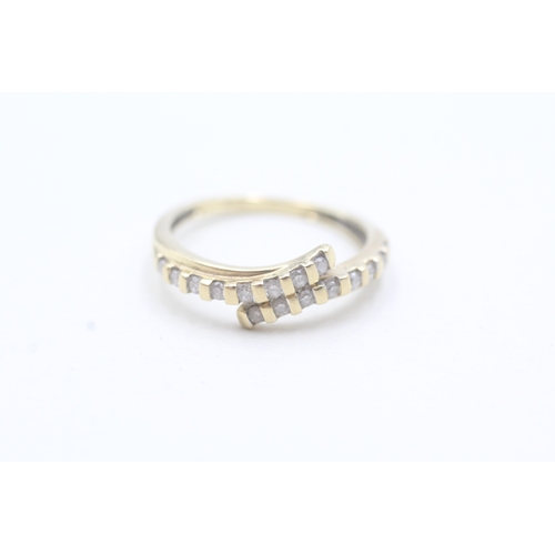 16 - 9ct gold diamond bypass row ring (2.4g) Size N 1/2