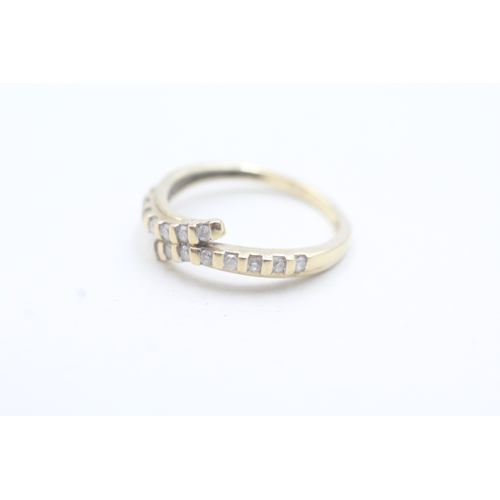 16 - 9ct gold diamond bypass row ring (2.4g) Size N 1/2