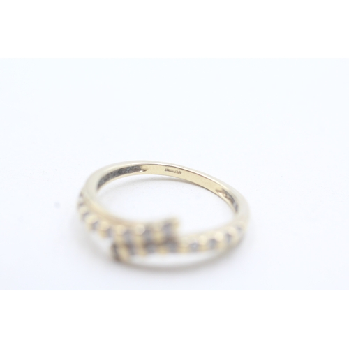 16 - 9ct gold diamond bypass row ring (2.4g) Size N 1/2