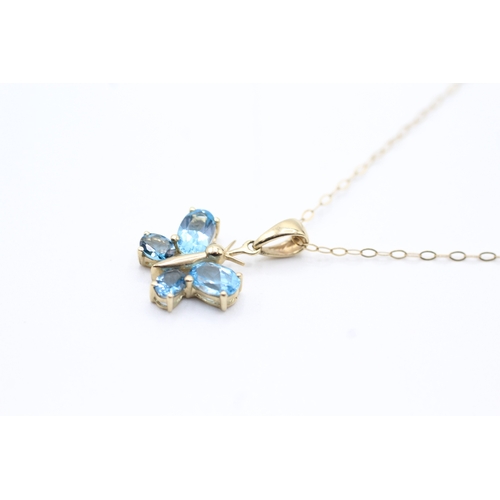 160 - 9ct gold blue gemstone butterfly pendant on chain (1.4g)