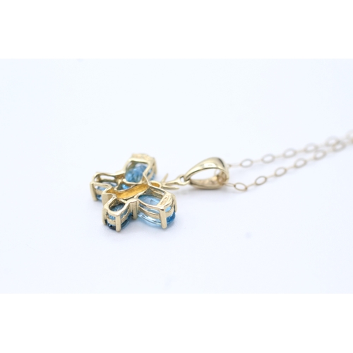 160 - 9ct gold blue gemstone butterfly pendant on chain (1.4g)