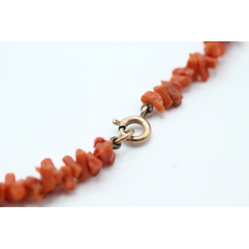 168 - 9ct gold clasped rough cut coral beaded necklace (9.6g)