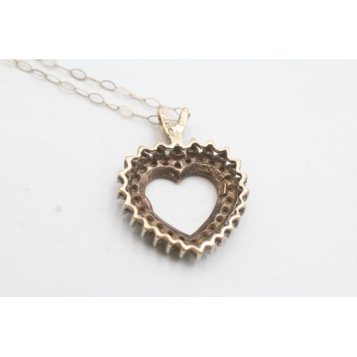 19 - 9ct gold diamond set heart pendant and chain (2.5g)