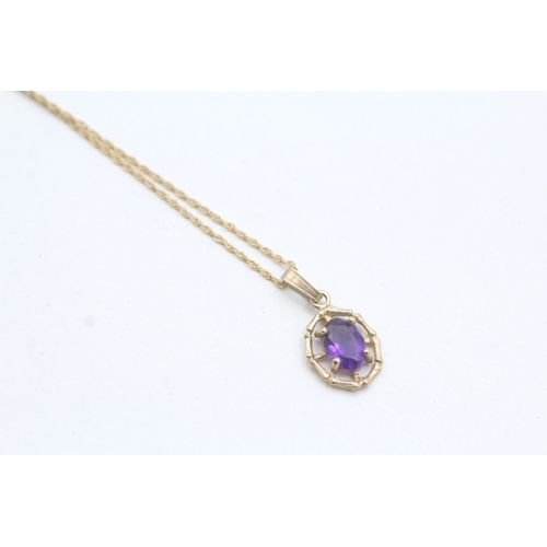 28 - 9ct gold amethyst framed pendant on chain (1.6g)