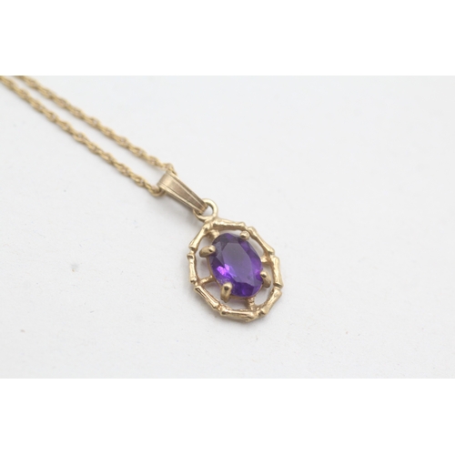 28 - 9ct gold amethyst framed pendant on chain (1.6g)