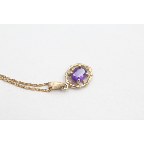 28 - 9ct gold amethyst framed pendant on chain (1.6g)