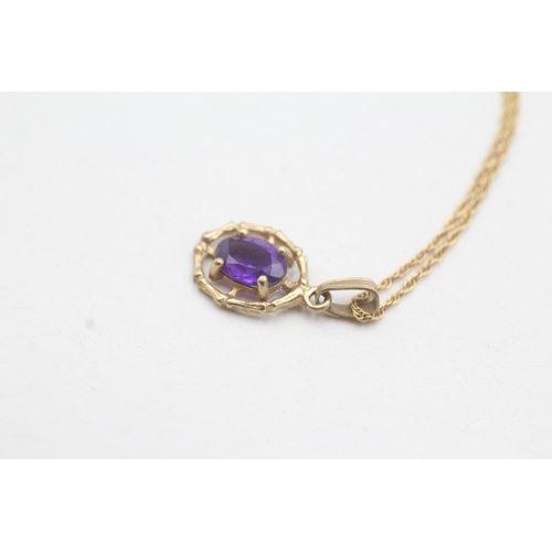 28 - 9ct gold amethyst framed pendant on chain (1.6g)