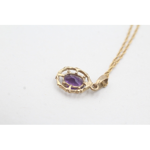 28 - 9ct gold amethyst framed pendant on chain (1.6g)