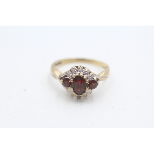 30 - 9ct gold diamond and garnet floral halo ring (2.3g) Size M 1/2