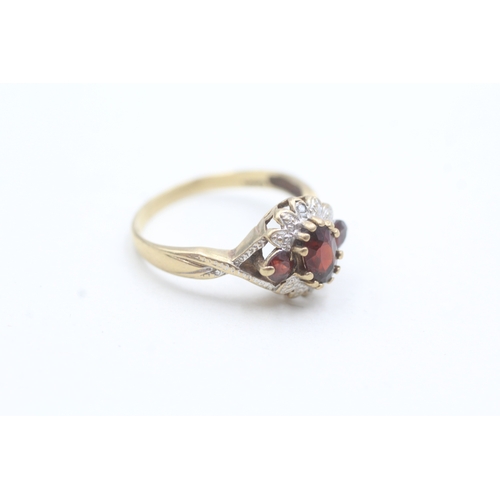 30 - 9ct gold diamond and garnet floral halo ring (2.3g) Size M 1/2