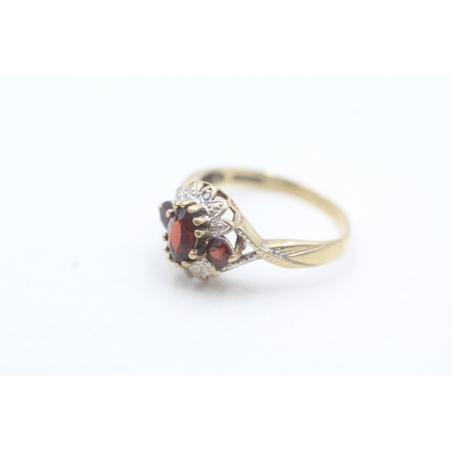 30 - 9ct gold diamond and garnet floral halo ring (2.3g) Size M 1/2