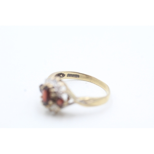 30 - 9ct gold diamond and garnet floral halo ring (2.3g) Size M 1/2