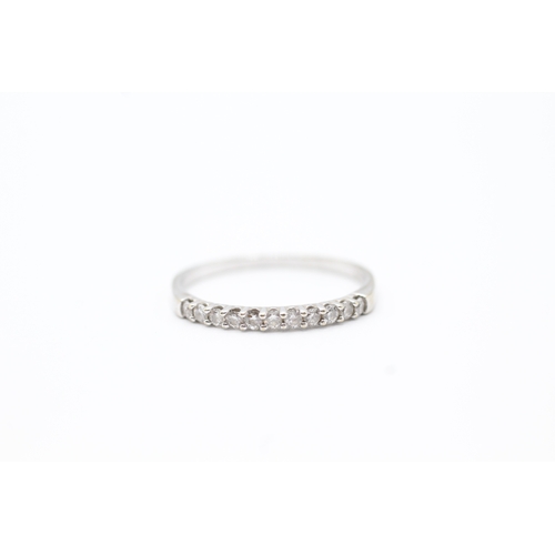 33 - 9ct white gold diamond set eternity ring (1.2g) Size O 1/2