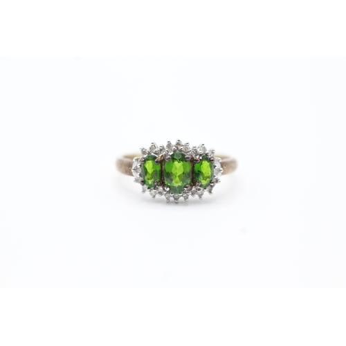 37 - 9ct gold diamond and green gemstone set trilogy cluster ring (2g) Size N