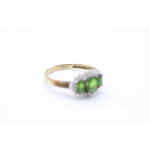 37 - 9ct gold diamond and green gemstone set trilogy cluster ring (2g) Size N