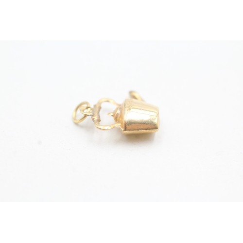 52 - 9ct gold stove kettle charm (0.9g)