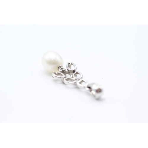 66 - 9ct gold diamond and cultured pearl pendant (1.6g)