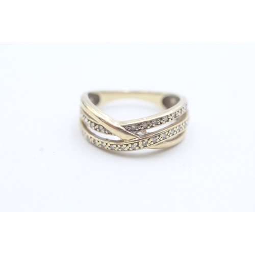 7 - 9ct gold diamond twin row twist ring (3.1g) Size M 1/2