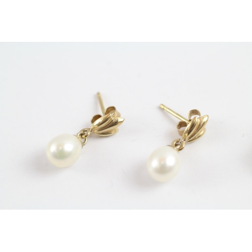 86 - 9ct gold x2 pearl stud earring set (2.3g)