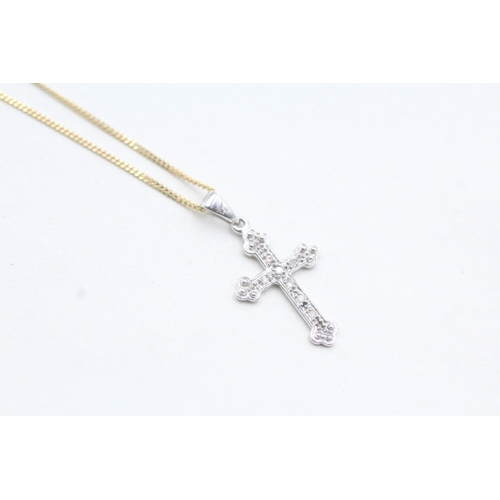 87 - 9ct white gold diamond set cross pendant and yellow gold chain (2.1g)