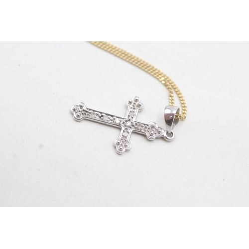 87 - 9ct white gold diamond set cross pendant and yellow gold chain (2.1g)