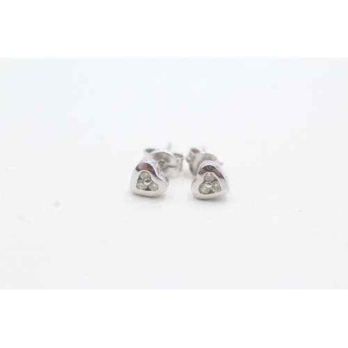 89 - 9ct white gold diamond heart shape stud earrings (0.8g)