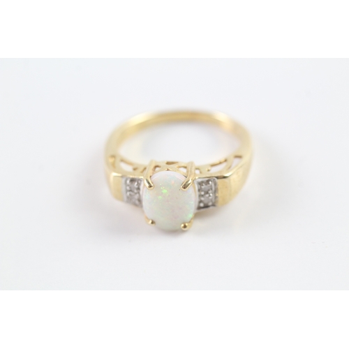 114 - 9ct gold cabochon cut opal dress ring w/ diamond set shoulders (3.5g) Size N 1/2