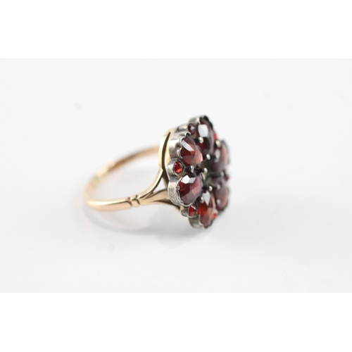 23 - 9ct gold and silver garnet ring (4.2g)