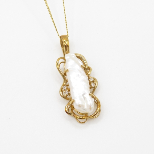 3 - 9ct gold baroque pearl and diamond pendant on chain (3.4g)