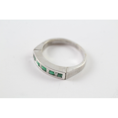 38 - 18ct white gold emerald and diamond row ring (4.7g) Size L