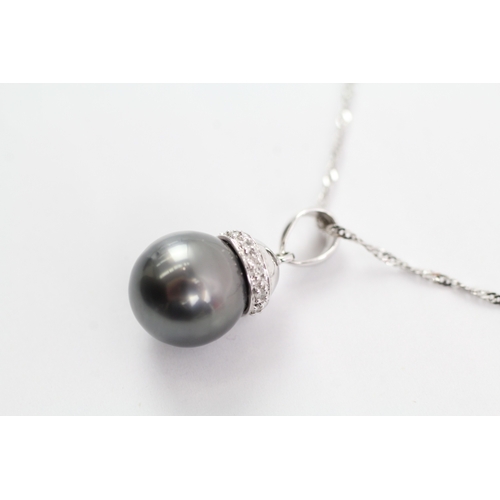 5 - 18ct white gold cultured pearl and diamond pendant on chain (4g)