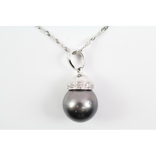 5 - 18ct white gold cultured pearl and diamond pendant on chain (4g)