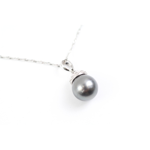 5 - 18ct white gold cultured pearl and diamond pendant on chain (4g)