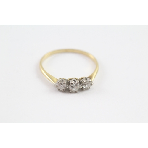 66 - 18ct gold three stone diamond ring (1.6g) Size K 1/2