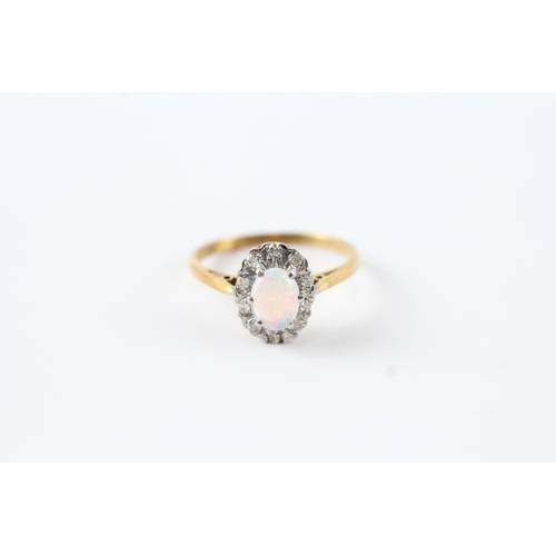 70 - 18ct gold opal and diamond halo set ring (3g) Size O 1/2