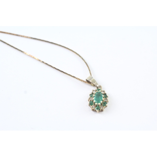 72 - 14ct gold emerald and diamond cluster halo pendant on chain (3.4g)