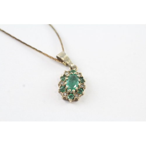 72 - 14ct gold emerald and diamond cluster halo pendant on chain (3.4g)