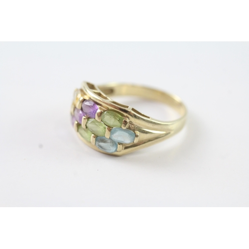 74 - 9ct gold blue, green, purple and yellow gemstone ring (3.3g) Size P 1/2