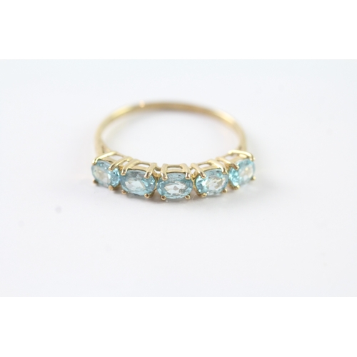 99 - 9ct gold oval cut blue gemstone half eternity ring (2.2g) Size V