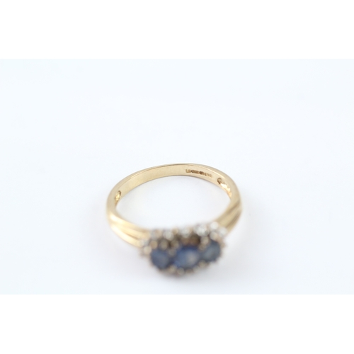 283 - 9ct gold tanzanite & diamond trilogy cluster ring (2.6g) Size N