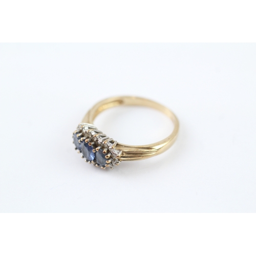 283 - 9ct gold tanzanite & diamond trilogy cluster ring (2.6g) Size N