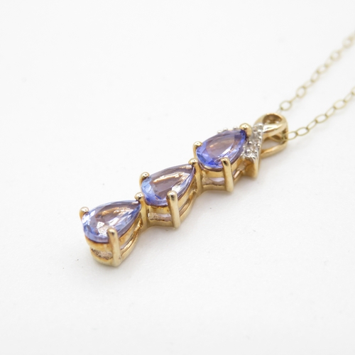 19 - 9ct gold pear cut tanzanite & diamond drop pendant necklace (1.8g)