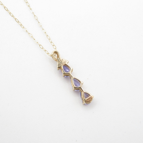 19 - 9ct gold pear cut tanzanite & diamond drop pendant necklace (1.8g)
