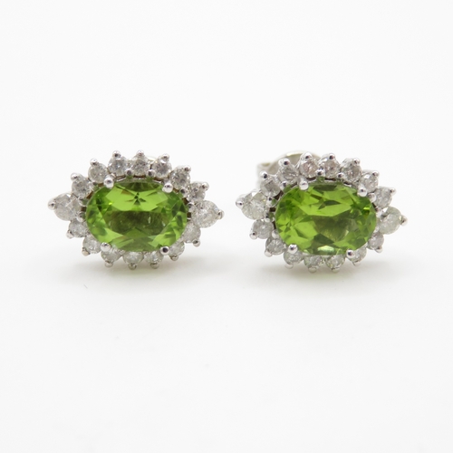 102 - 18ct white gold peridot and diamond stud earrings (3.2g)