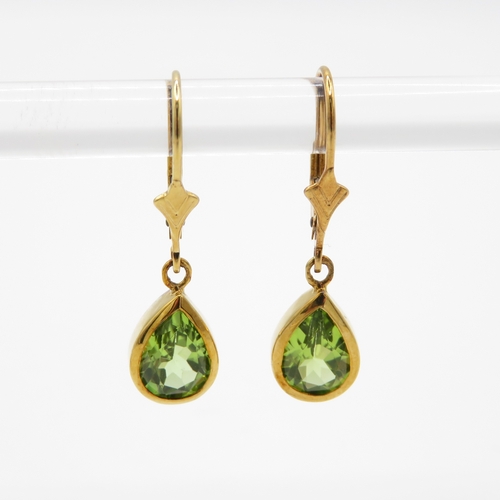 67 - 9ct gold pear cut peridot drop earrings (2.1g)