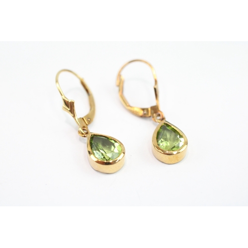 67 - 9ct gold pear cut peridot drop earrings (2.1g)