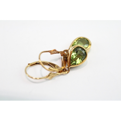 67 - 9ct gold pear cut peridot drop earrings (2.1g)