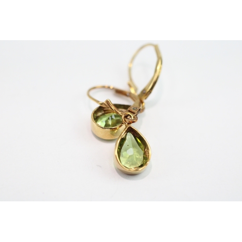 67 - 9ct gold pear cut peridot drop earrings (2.1g)