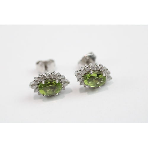 102 - 18ct white gold peridot and diamond stud earrings (3.2g)
